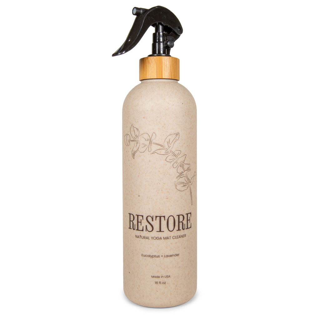 Yoloha Yoga 16oz all-purpose yoga mat cleaner in a spray bottle, designed to refresh and clean yoga mats effectively.