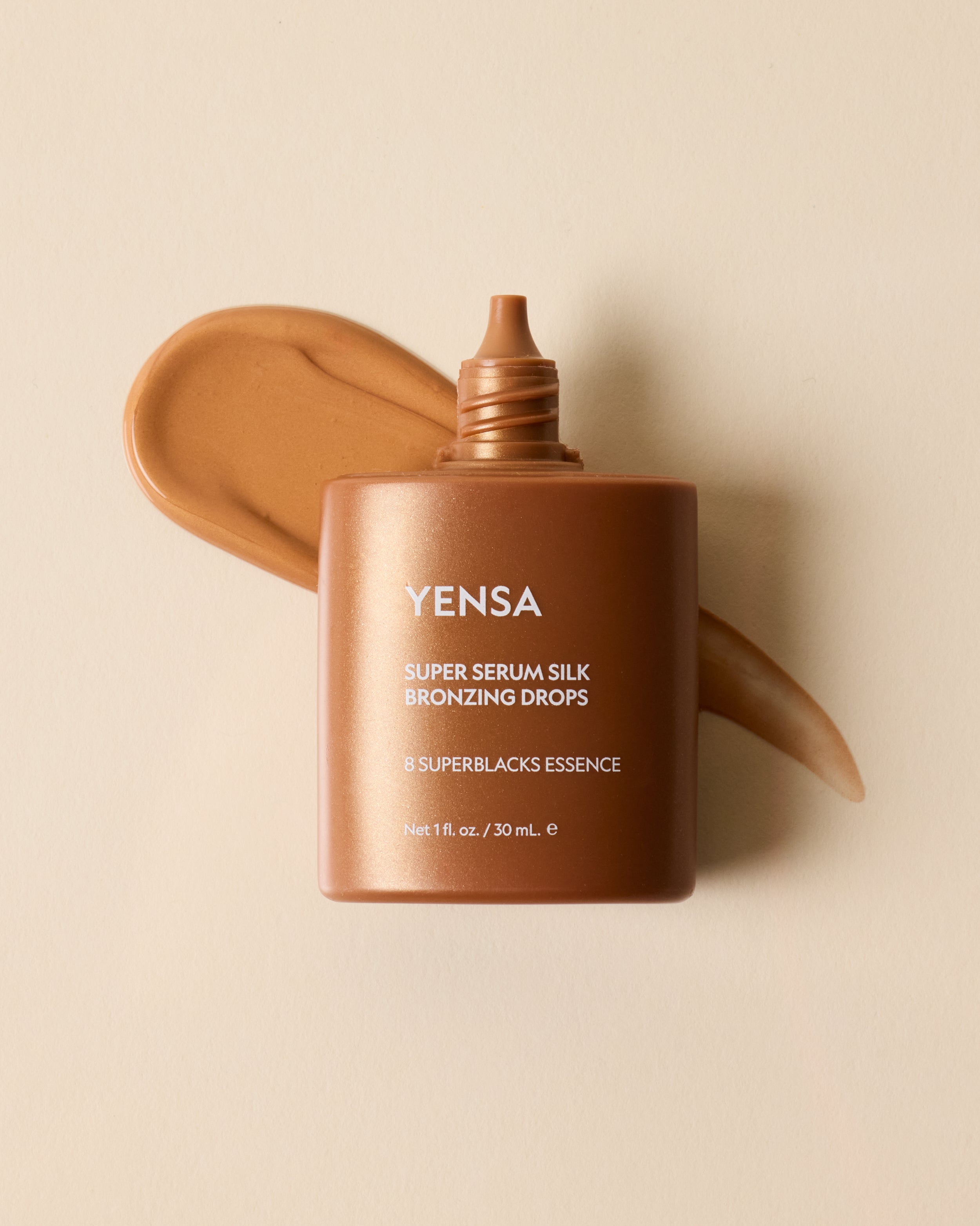 YENSA Super Serum Silk Bronzing Drops in a sleek bottle, showcasing the bronzer product with a smooth, luxurious finish.